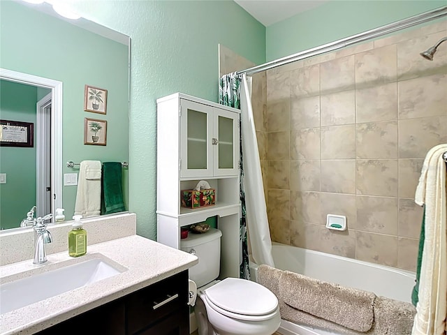 bathroom with shower / bath combination with curtain, toilet, and vanity