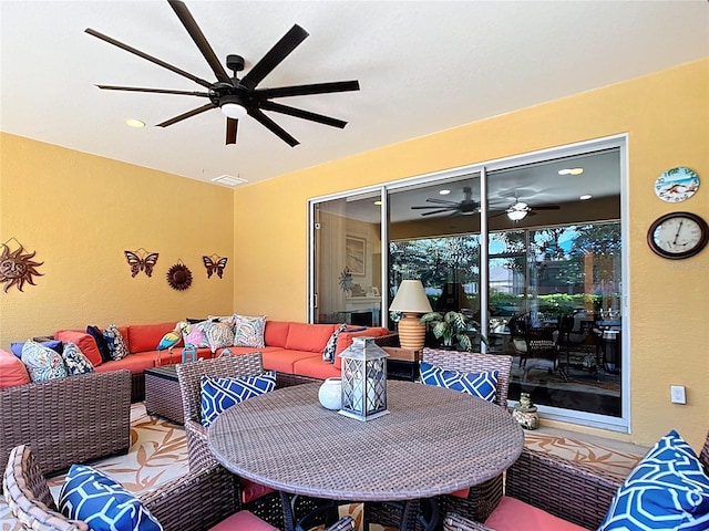 view of patio / terrace featuring an outdoor living space and a ceiling fan