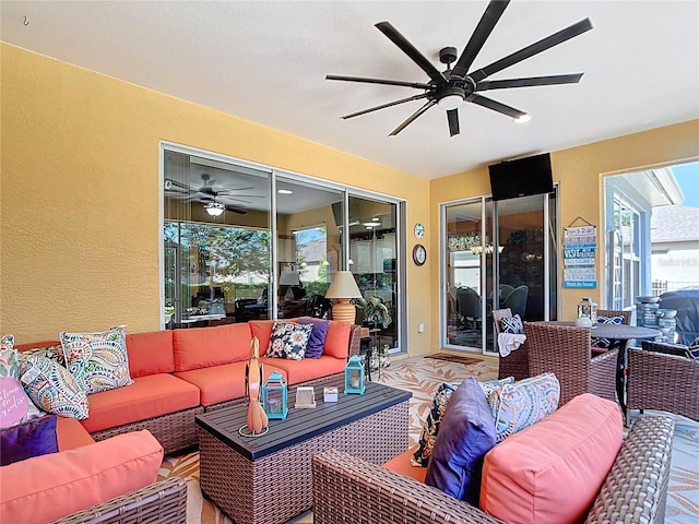 view of patio with an outdoor hangout area and a ceiling fan