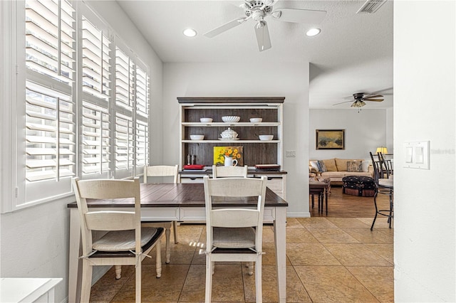 dining room featuring a ceiling fan, visible vents, baseboards, recessed lighting, and tile patterned flooring