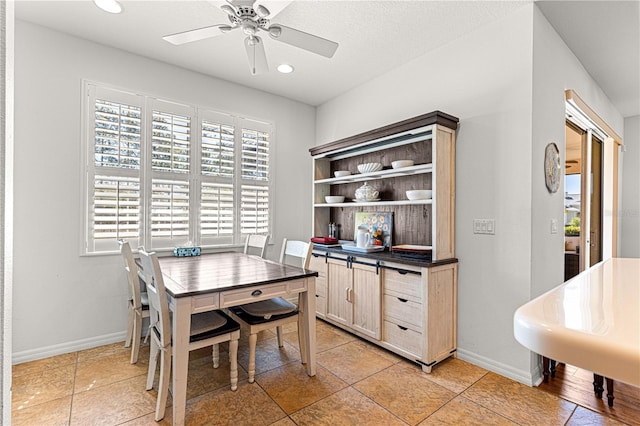 dining area with recessed lighting, baseboards, a textured ceiling, and a ceiling fan