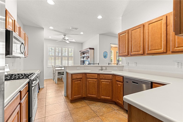 kitchen featuring a sink, visible vents, a wealth of natural light, and stainless steel appliances