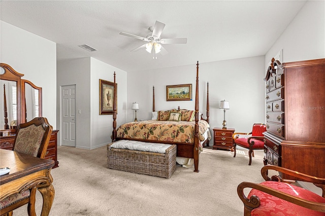 bedroom featuring a ceiling fan, light colored carpet, and visible vents