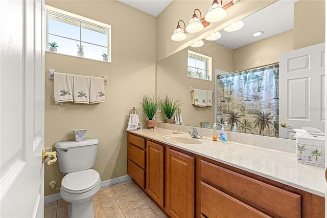 full bathroom featuring tile patterned floors, a shower with curtain, toilet, baseboards, and vanity