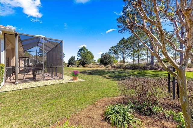 view of yard with a lanai and a patio area