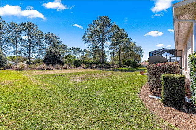 view of yard featuring a lanai