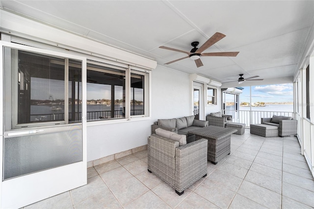 sunroom featuring ceiling fan