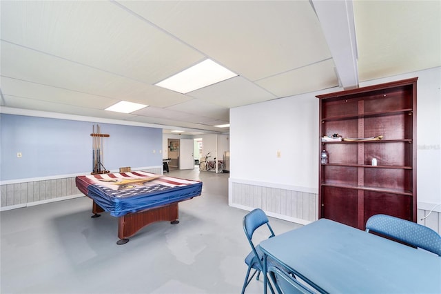 game room featuring a wainscoted wall, finished concrete floors, and pool table