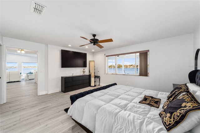 bedroom featuring baseboards, visible vents, recessed lighting, ceiling fan, and light wood-type flooring