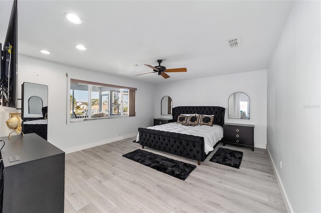 bedroom featuring visible vents, recessed lighting, light wood-type flooring, and baseboards