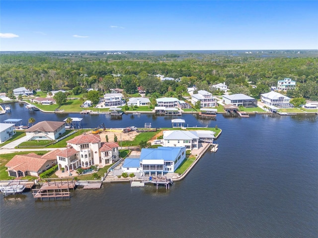 bird's eye view with a residential view and a water view