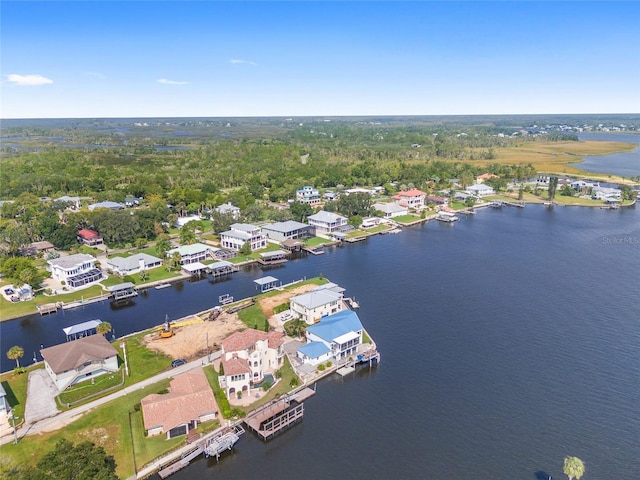 drone / aerial view with a residential view and a water view