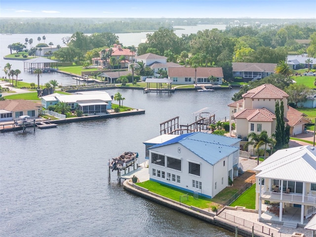 bird's eye view featuring a residential view and a water view