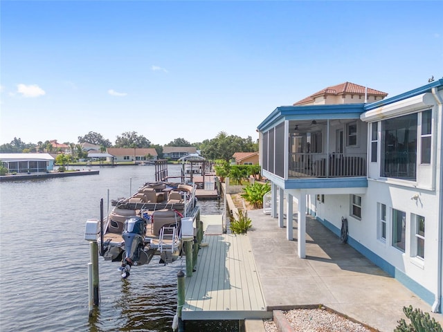 dock area featuring a water view and boat lift