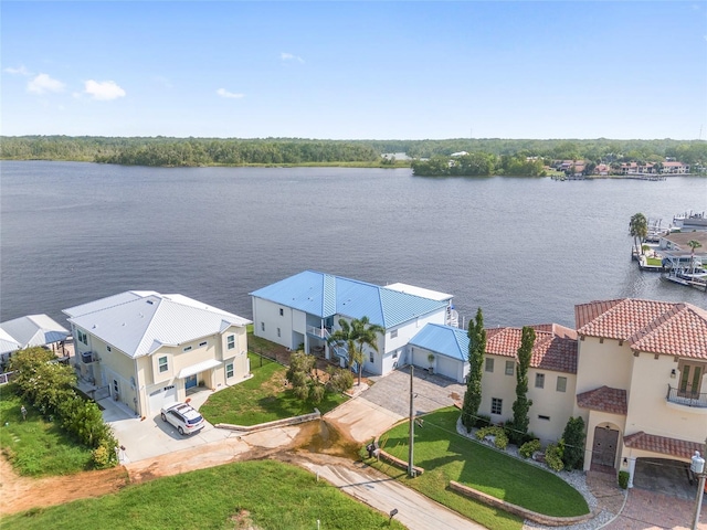 drone / aerial view featuring a residential view and a water view