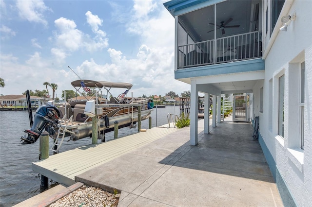 view of dock featuring boat lift and a water view