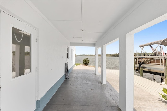 view of patio with a boat dock