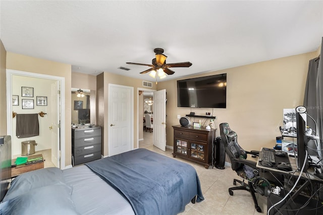 bedroom with light tile patterned floors, visible vents, connected bathroom, and ceiling fan