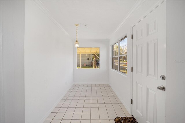 829 NE 15th Ave, Ocala, FL 34470 - unfurnished dining area with crown molding, light tile patterned flooring, and baseboards