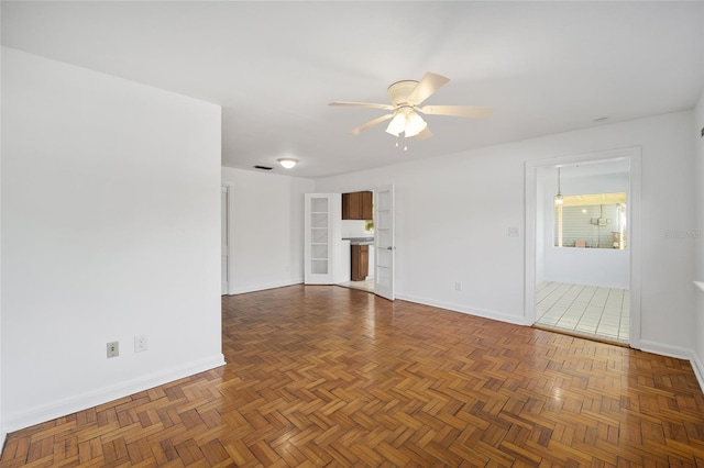 829 NE 15th Ave, Ocala, FL 34470 - unfurnished living room featuring visible vents, baseboards, and a ceiling fan
