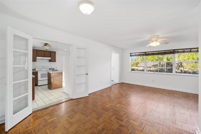 829 NE 15th Ave, Ocala, FL 34470 - spare room with baseboards and a ceiling fan
