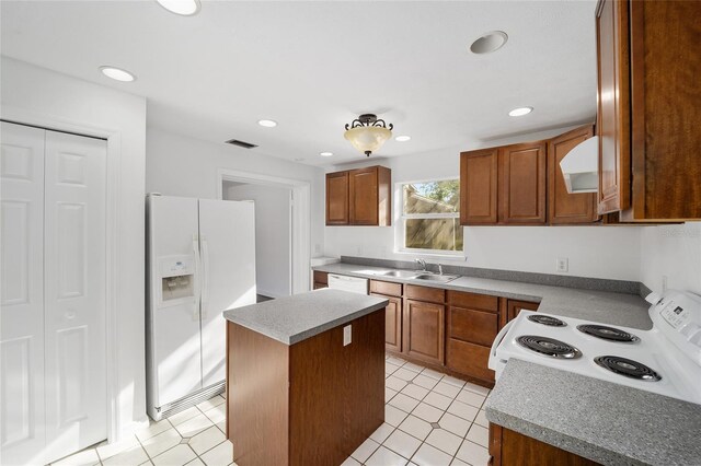 829 NE 15th Ave, Ocala, FL 34470 - kitchen featuring white appliances, ventilation hood, brown cabinetry, visible vents, and a center island