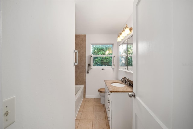 829 NE 15th Ave, Ocala, FL 34470 - full bath featuring tile patterned floors, baseboards, toilet, and vanity
