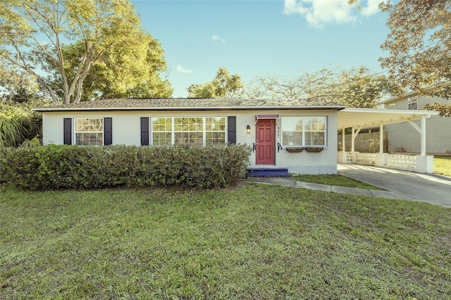 829 NE 15th Ave, Ocala, FL 34470 - ranch-style house with driveway, an attached carport, and a front lawn
