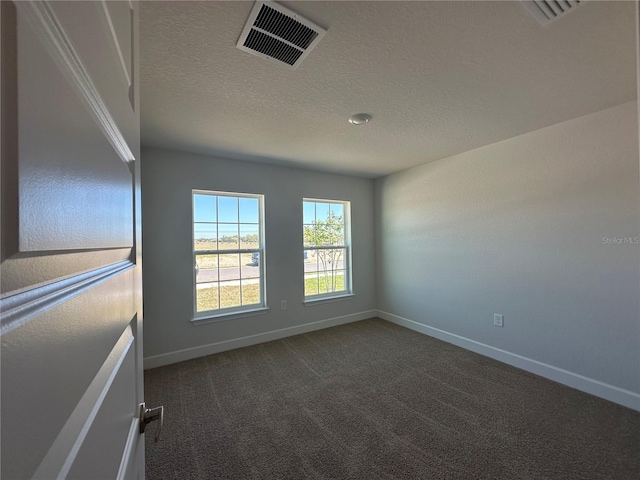 4528 SW 90th Lane Rd, Ocala, FL 34476 - unfurnished room featuring baseboards, dark carpet, and a textured ceiling
