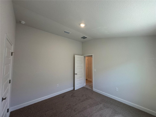 4528 SW 90th Lane Rd, Ocala, FL 34476 - unfurnished bedroom with vaulted ceiling, baseboards, and carpet floors