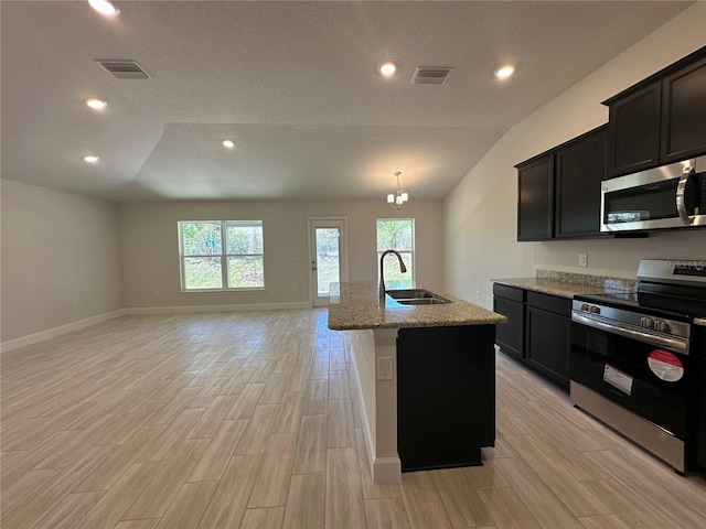 4528 SW 90th Lane Rd, Ocala, FL 34476 - kitchen with stainless steel appliances, a sink, healthy amount of natural light, light stone countertops, and lofted ceiling