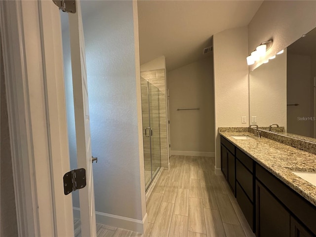 4528 SW 90th Lane Rd, Ocala, FL 34476 - full bath with double vanity, a stall shower, baseboards, and wood finished floors
