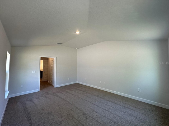 4528 SW 90th Lane Rd, Ocala, FL 34476 - empty room featuring vaulted ceiling, baseboards, and dark colored carpet