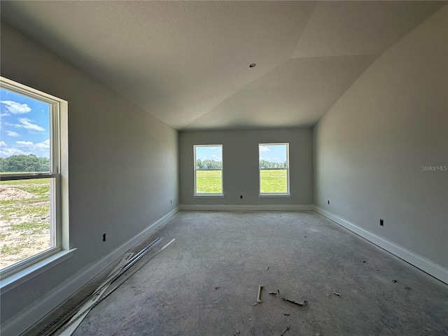 4528 SW 90th Lane Rd, Ocala, FL 34476 - empty room with vaulted ceiling and baseboards