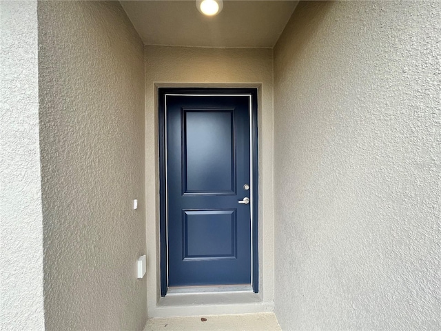 4498 SW 90th Lane Rd, Ocala, FL 34476 - doorway to property featuring stucco siding