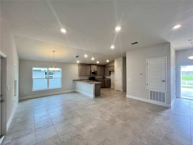 4498 SW 90th Lane Rd, Ocala, FL 34476 - kitchen with a chandelier, open floor plan, baseboards, recessed lighting, and a peninsula