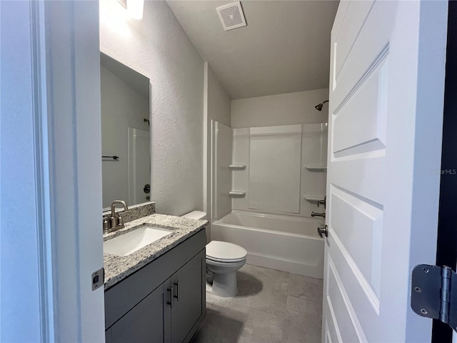 4498 SW 90th Lane Rd, Ocala, FL 34476 - bathroom featuring a textured wall, vanity, toilet, and shower / bathtub combination