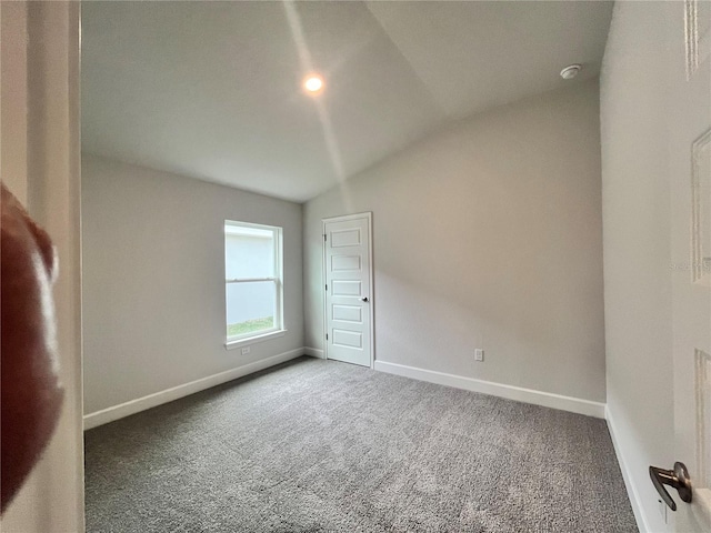 4498 SW 90th Lane Rd, Ocala, FL 34476 - carpeted spare room featuring vaulted ceiling and baseboards