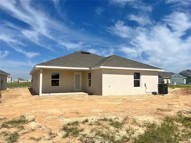 4498 SW 90th Lane Rd, Ocala, FL 34476 - back of house with a shingled roof and stucco siding