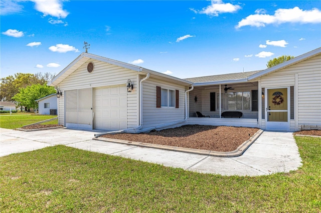 10980 SW 62nd Avenue Rd, Ocala, FL 34476 - ranch-style house with concrete driveway, a garage, a ceiling fan, and a front yard