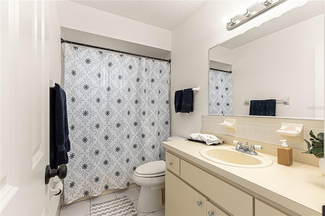 10980 SW 62nd Avenue Rd, Ocala, FL 34476 - full bathroom with toilet, vanity, decorative backsplash, tile patterned floors, and a textured ceiling