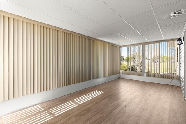 10980 SW 62nd Avenue Rd, Ocala, FL 34476 - empty room featuring visible vents, a drop ceiling, and wood finished floors