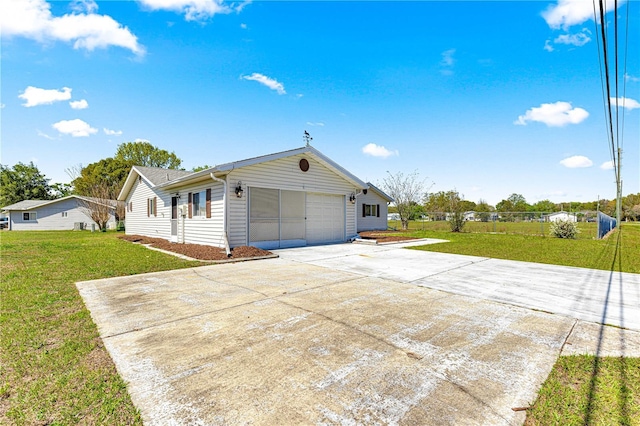 10980 SW 62nd Avenue Rd, Ocala, FL 34476 - view of front of home with a garage, concrete driveway, a front yard, and fence