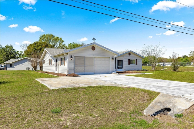10980 SW 62nd Avenue Rd, Ocala, FL 34476 - ranch-style home with concrete driveway, a garage, and a front lawn