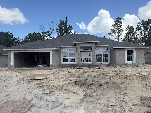 719 Hallam Dr, Citrus Springs, FL 34434 - view of front facade with a garage and a shingled roof