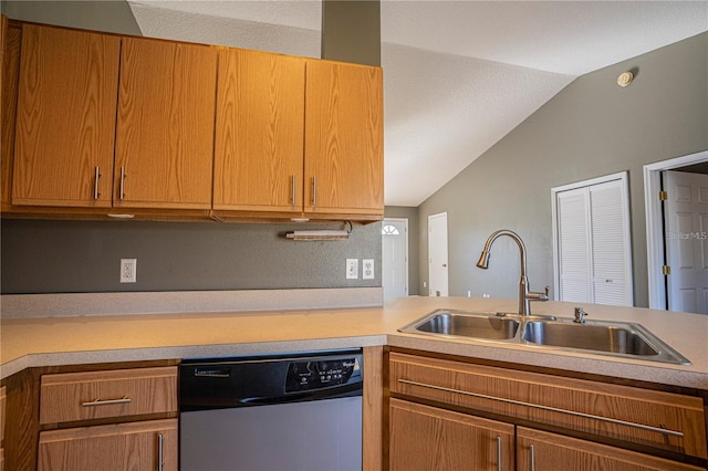 kitchen with dishwasher, light countertops, vaulted ceiling, and a sink