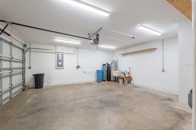 9 Hemlock Run, Ocala, FL 34472 - garage featuring electric panel, a garage door opener, and concrete block wall