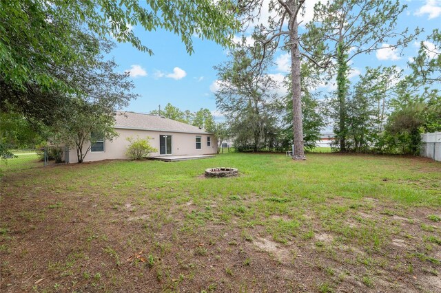 9 Hemlock Run, Ocala, FL 34472 - fenced backyard featuring an outdoor fire pit