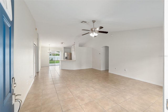 9 Hemlock Run, Ocala, FL 34472 - unfurnished living room featuring ceiling fan, light tile patterned flooring, arched walkways, and vaulted ceiling