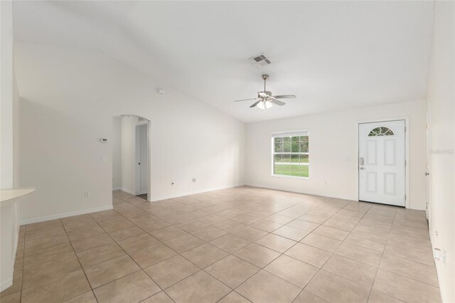 9 Hemlock Run, Ocala, FL 34472 - unfurnished living room with ceiling fan, lofted ceiling, light tile patterned floors, and arched walkways
